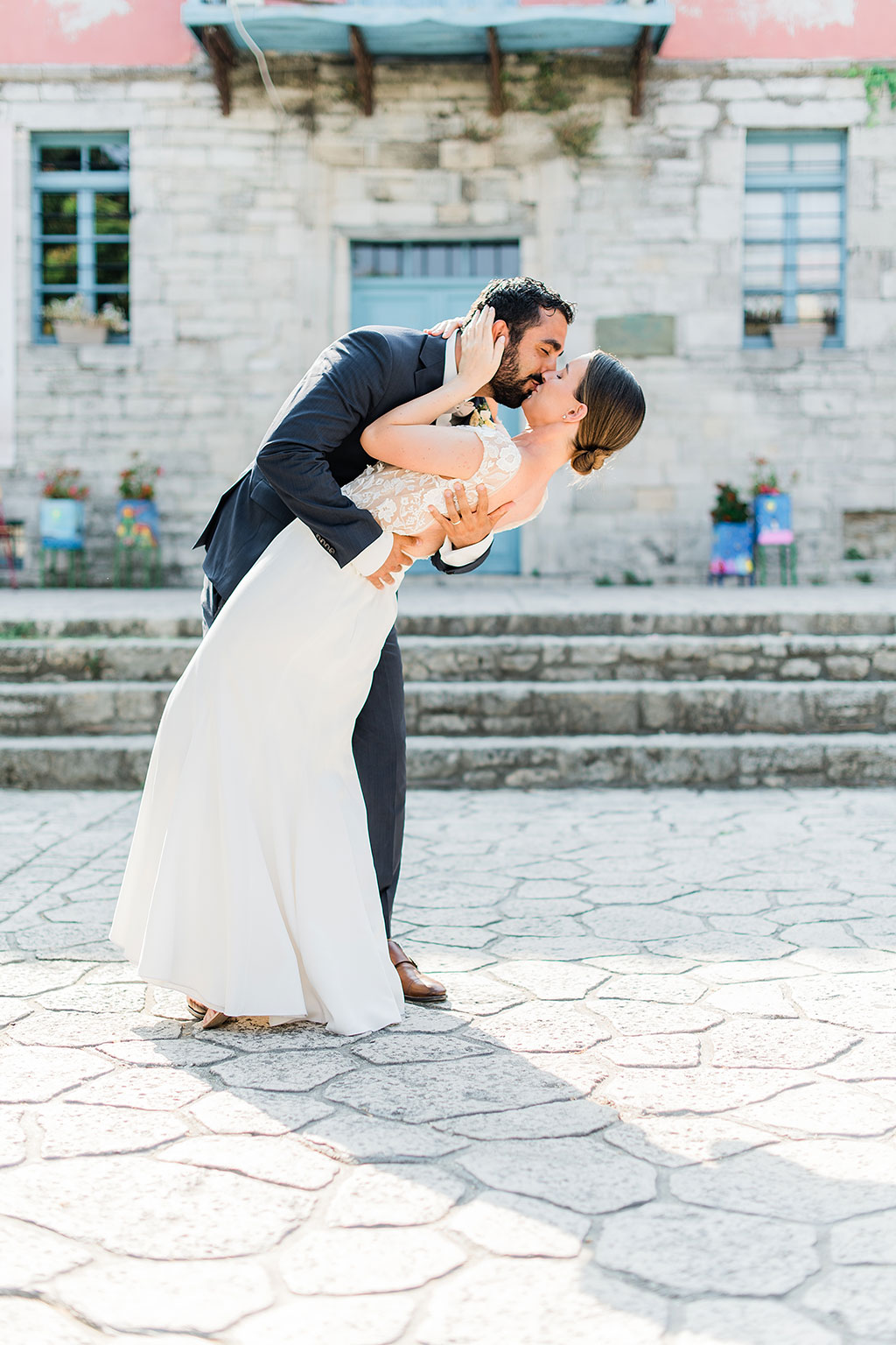 A sweet kiss between groom and bride in post wedding photoshoot
